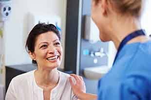 Patient in Deer Park smiling with dentures